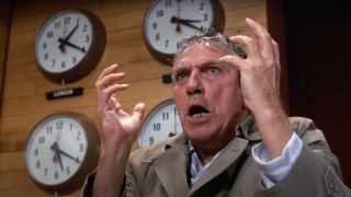 Peter Finch stands in the newsroom, looking mad as hell, in Network.