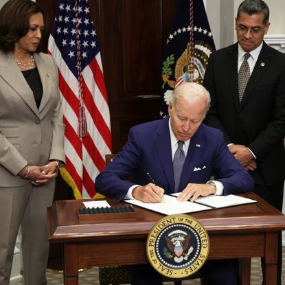  U.S. President Joe Biden signs an executive order on access to reproductive health care services as (L-R) Vice President Kamala Harris, Secretary of Health and Human Services Xavier Becerra look on