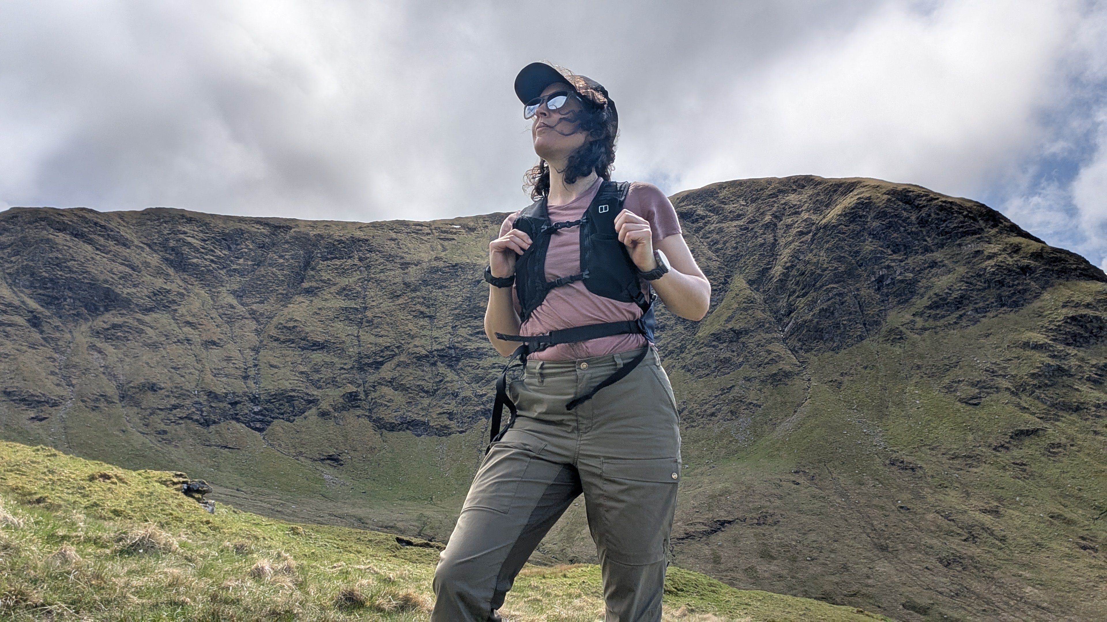 A woman hiking in the Scottish mountains with the Berghaus Fasthike F15 backpack