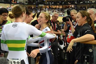 Laura Trott congratulates the Australians after they beat the British team and set a new world record.