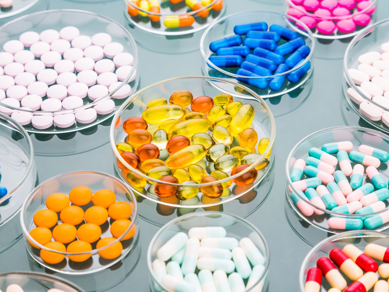 colourful pills in separate petri dishes.jpg