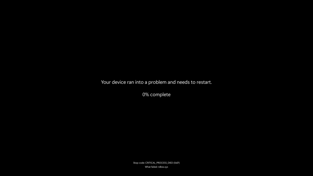 A plain black background with the text, "Your device ran into a problem and needs to restart." At the bottom is a unique stop code and explainer of what failed.