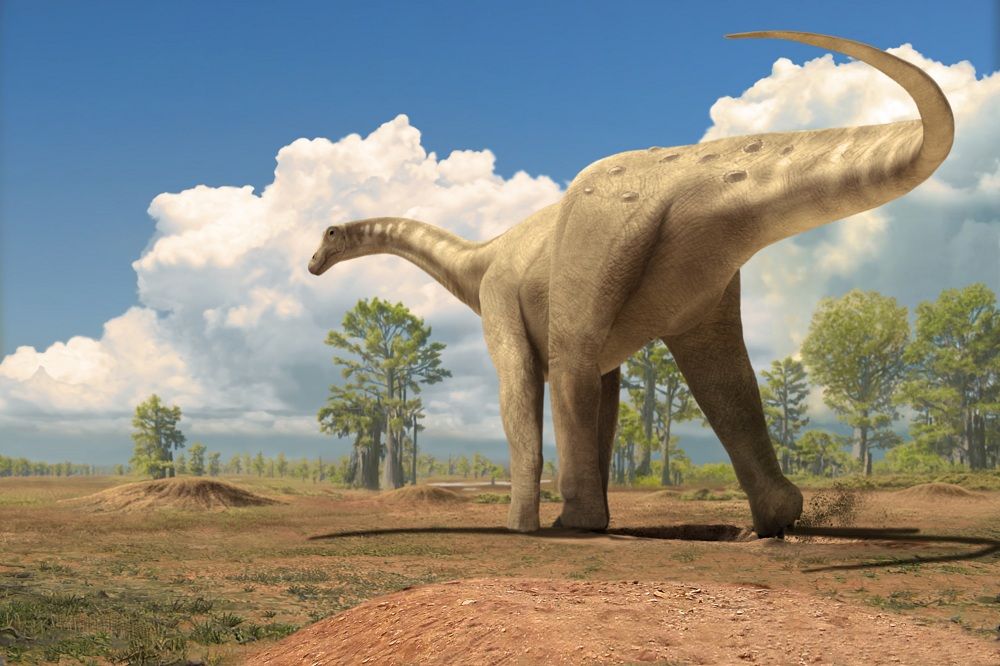 A large dinosaur walking a dusty landscape.