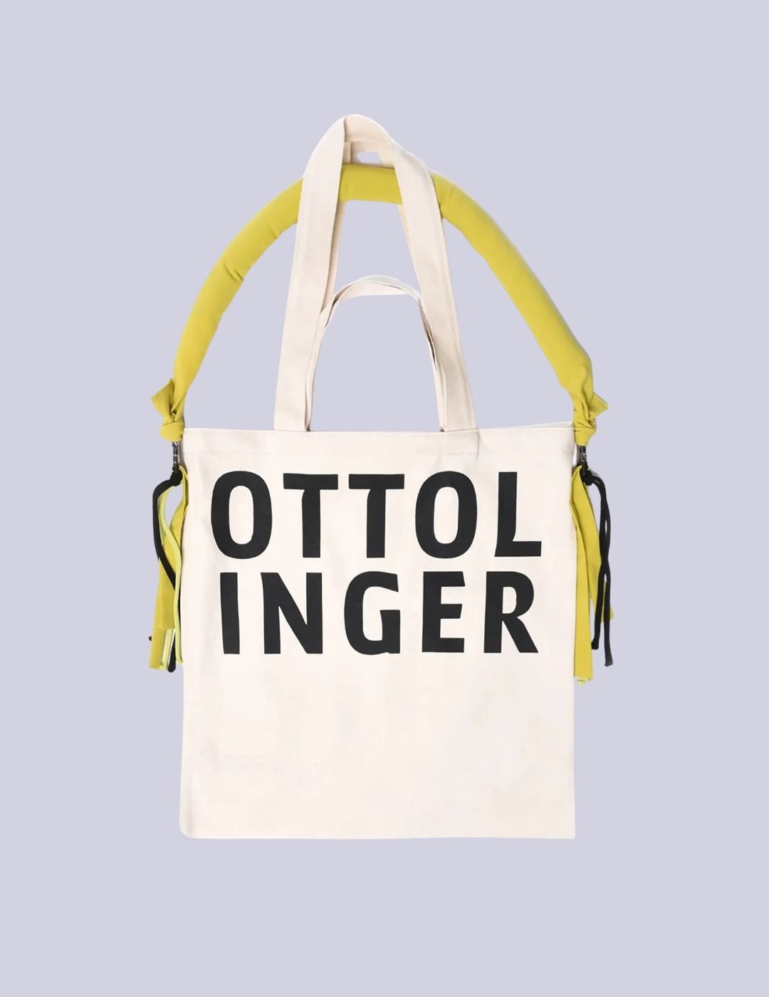 Ottolinger pale beige tote bag with yellow strap.