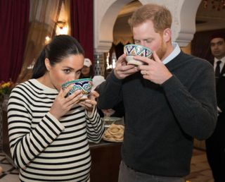 Meghan and Harry drinking soup
