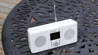 the pure elan connect+ dab radio on a wrought iron table