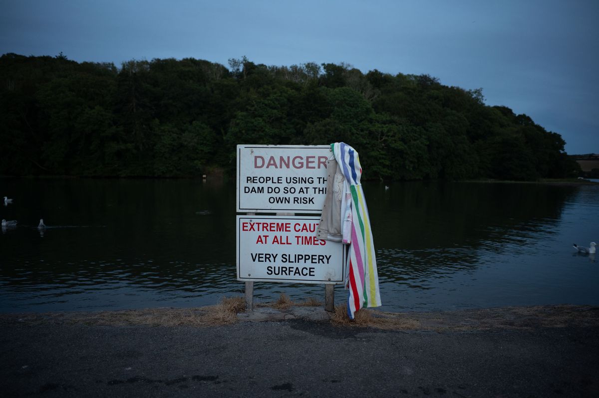 Danger sign alongside a river