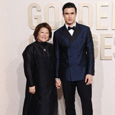 Charles Melton and his mother at the 2024 Golden Globes