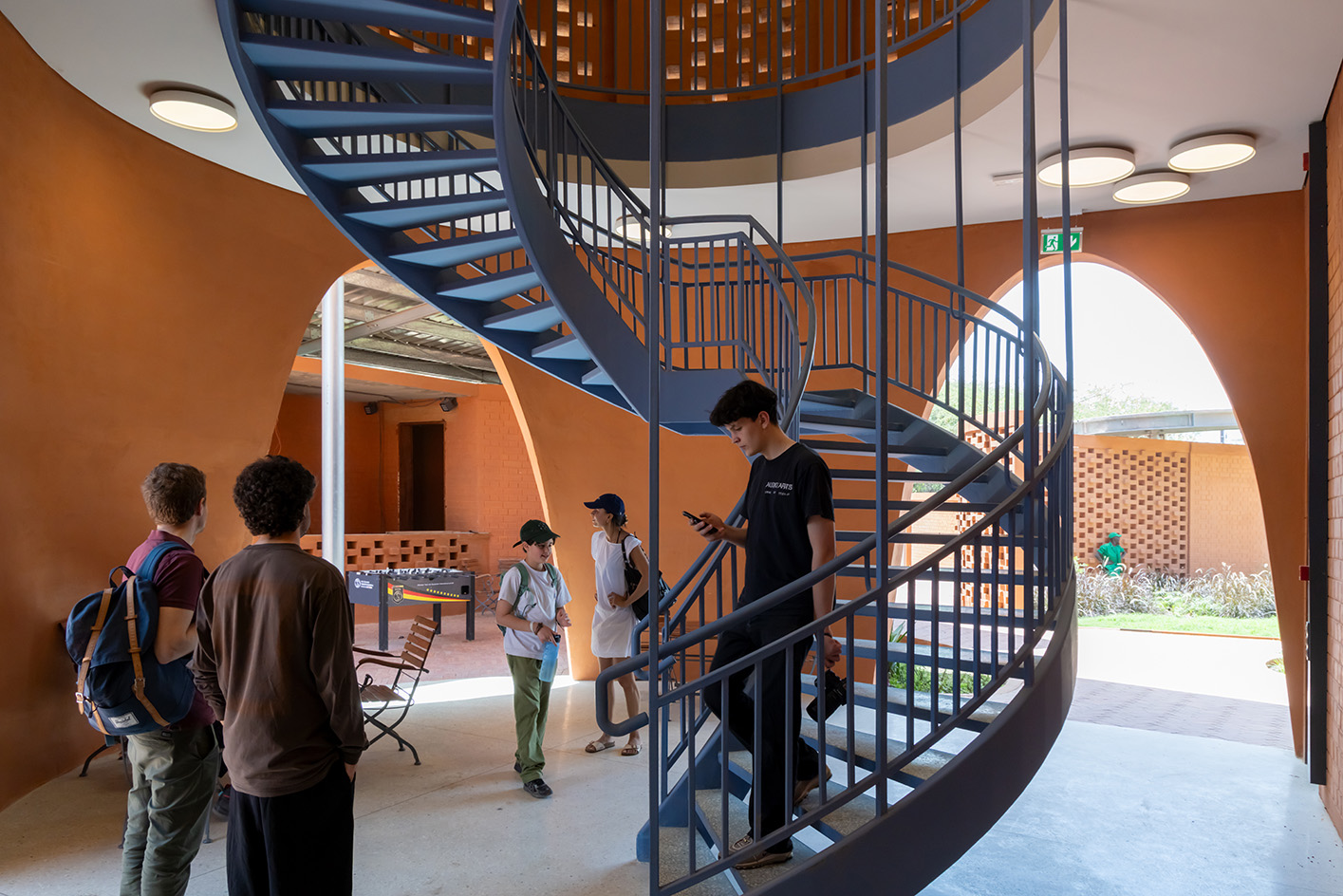 Goethe-Institut Dakar, brown earth block forms with wavy roofs designed by Francis Kere