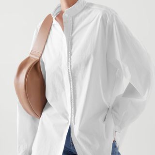 best shirts for women include this white ruffle fronted oversized shirt from Cos