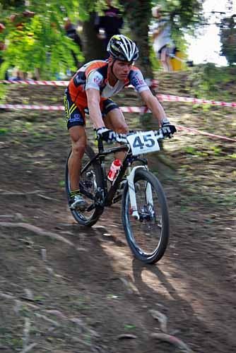 Toma Pesek (Scott Scania Team Kol) on a rooty downhill section