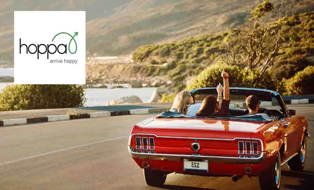 hoppa logo in top left placed over a red car driving on a windy road 