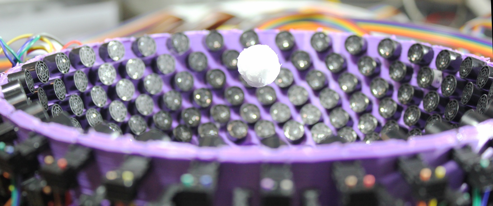 A styrofoam particle, 0.6 inches (1.6 cm) in diameter, levitates in the center of an ultrasonic generator of virtual vortices.