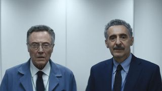 Irving and Burt (John Turturro and Christopher Walken) standing next to each other in Severance