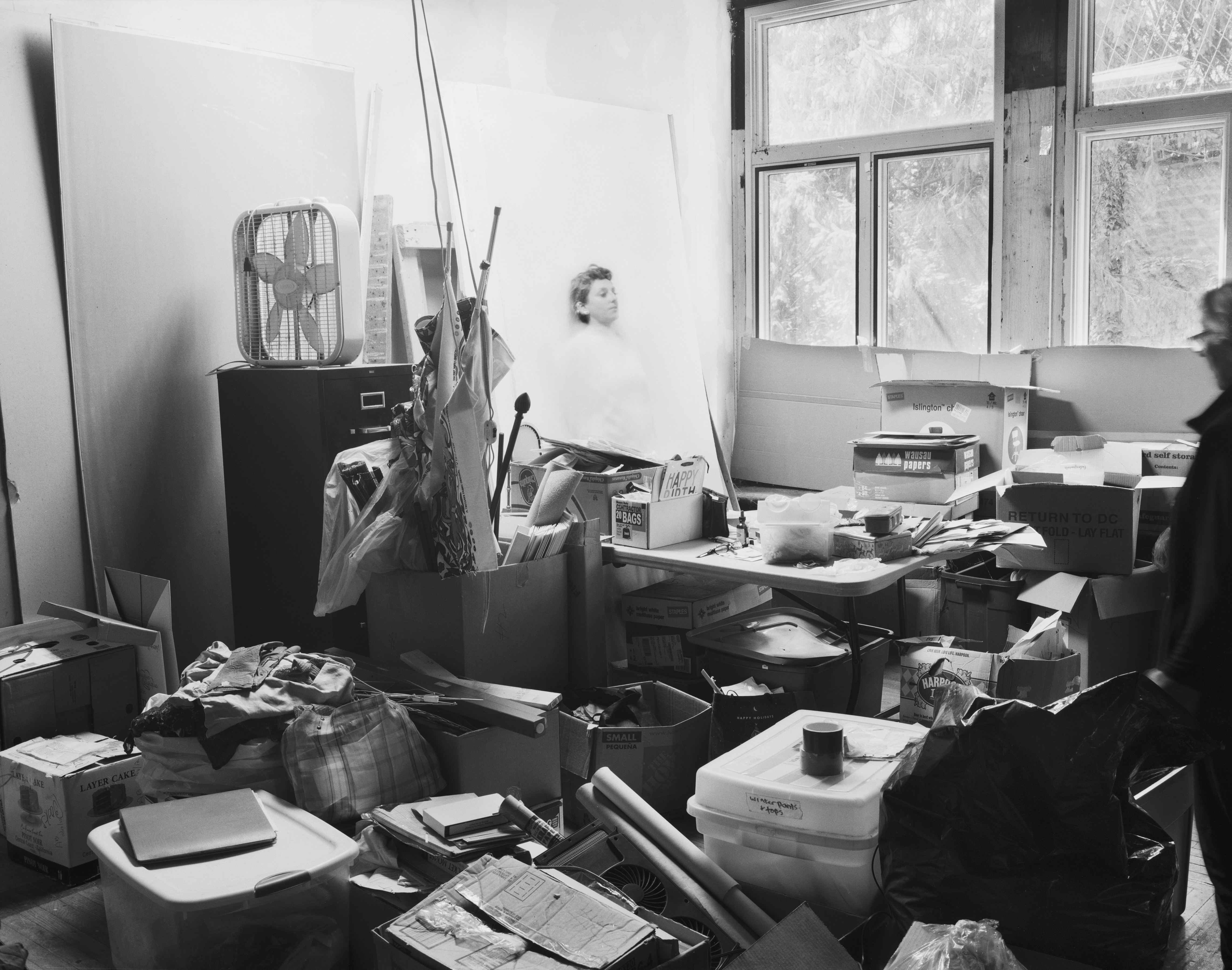 black and white images of an elderly woman in her house