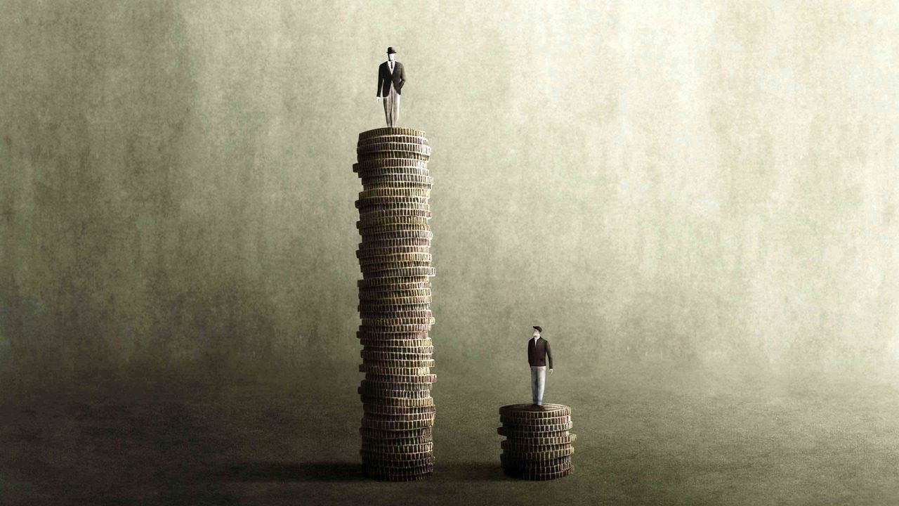 A person on top of a very tall stack of coins, and another person on a very small stack of coins