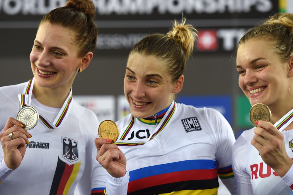 Gold medallist Daria Shmeleva of Russia poses with silver medallist Miriam Welte of Germany (L) and bronze medallist Anastasiia Voinova of Russia on the podium after the final of the women's 500m time trial