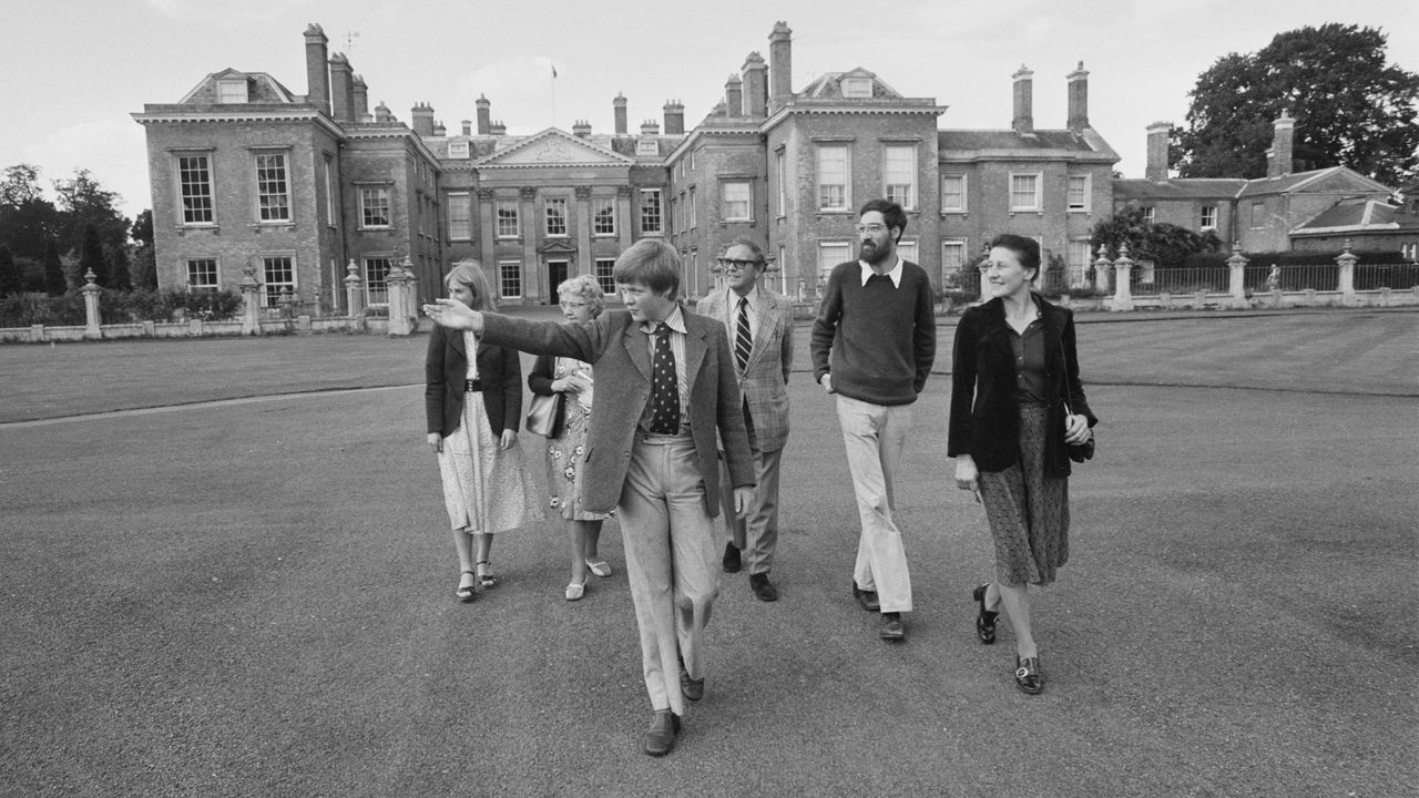 Charles Spencer in 1977, showing visitors around his home, Althorp