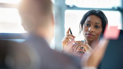 A woman attends a work meeting.