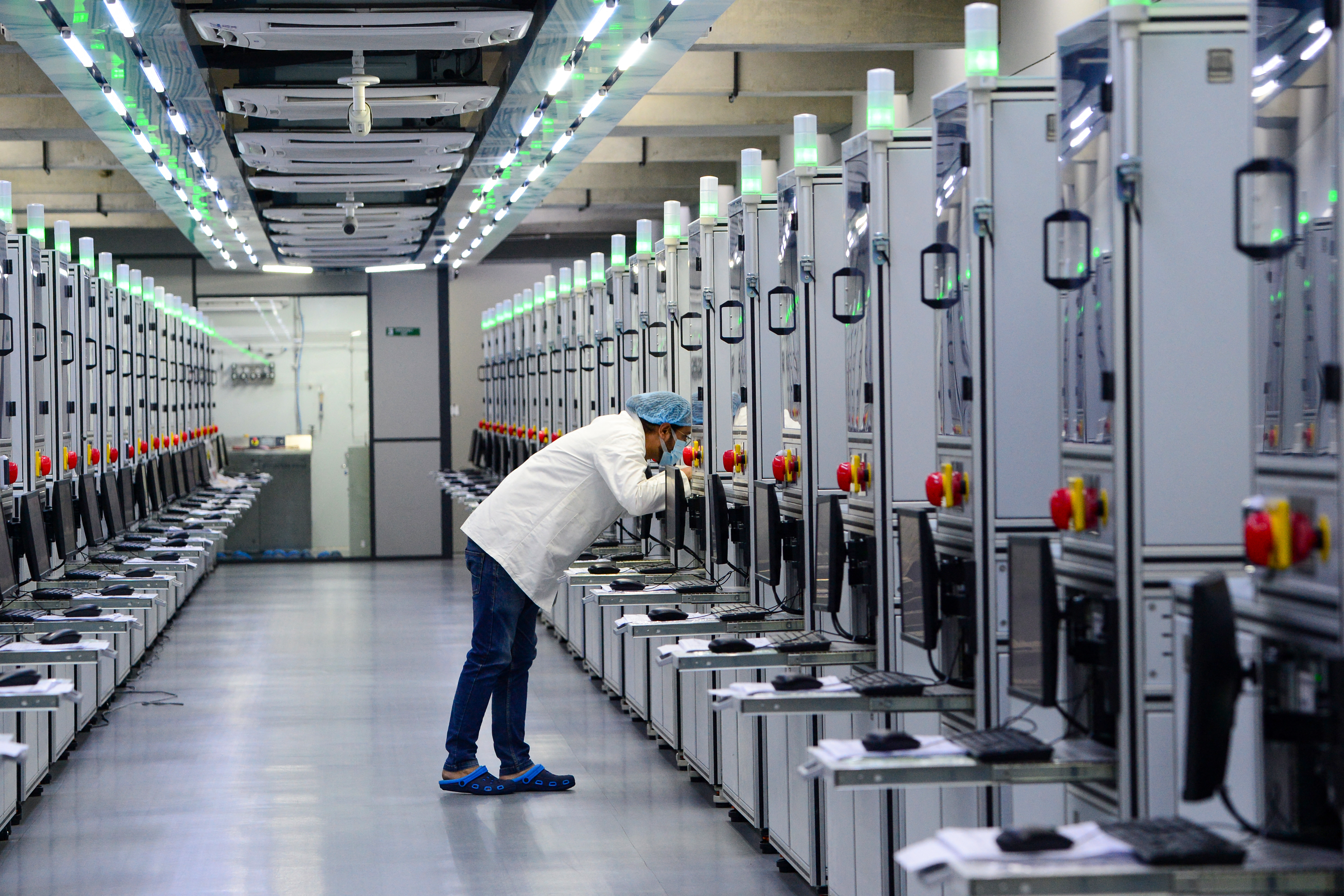 Laboratory technician monitoring the progress of lab-grown diamond seeds