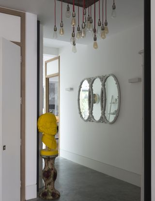 A gallery wall with three mirrors