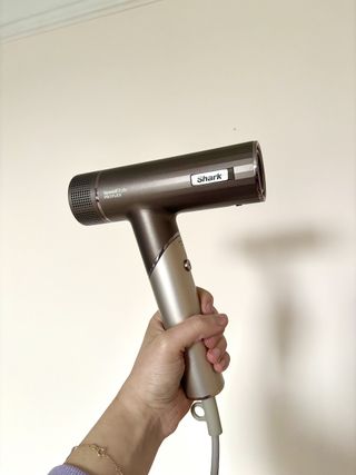 Mica Ricketts holding the Shark SpeedStyle PRO Flex Hair Dryer