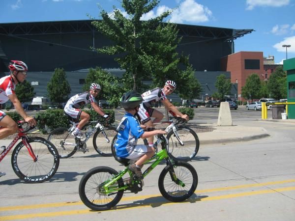 One of Hilton Clarke's young fans rides with the boys.
