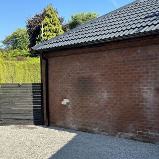 garden with brick wall and gravel