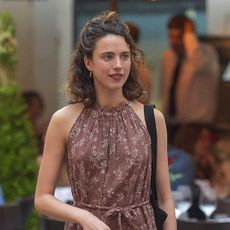 Margaret Qualley wearing a halter dress in Italy