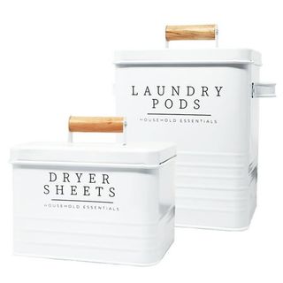 White metal laundry pod containers with black labels and wooden handles