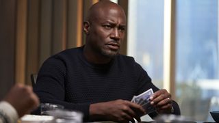 Taye Diggs as Harper Stewart playing cards in The Best Man: The Final Chapter