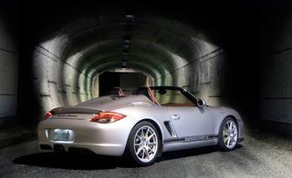 Silver sports car parked at an angle inside a tunnel
