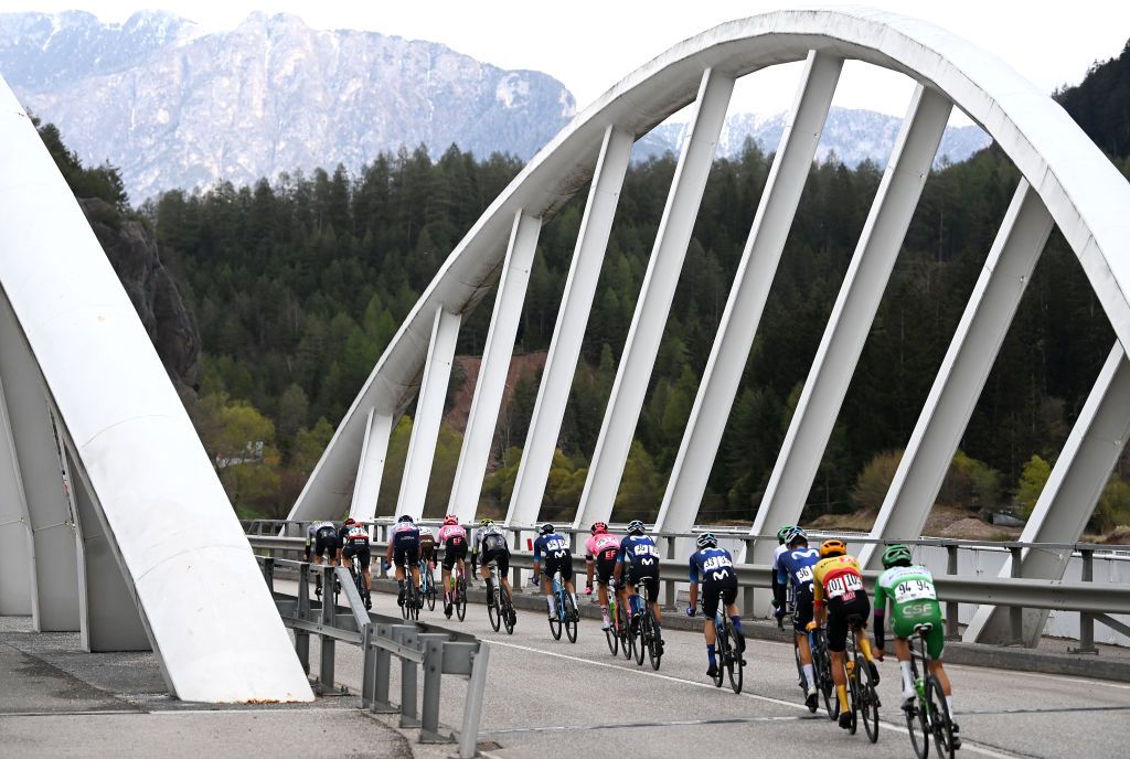 PREDAZZO ITALY APRIL 20 Simon Carr of United Kingdom and Team EF EducationEasypost Gregor Muhlberger of Austria and Movistar Team Stefan De Bod of South Africa and Team EF EducationEasypost Antonio Pedrero of Spain and Movistar Team Patrick Konrad of Austria and Team BORAHansgrohe scar Rodrguez of Spain and Movistar Team Geoffrey Bouchard of France and Ag2R Citron Team Sergio Samitier of Spain and Movistar Team Marco Frigo of Italy and Team IsraelPremier Tech Giulio Pellizzari of Italy and Green ProjectBardiani CsfFaizan Team Torstein Tren of Norway and UnoX Pro Cycling Team Henok Mulubrhan of Eritrea and Green ProjectBardiani CsfFaizan Team and Damien Howson of Australia and Q365 Pro Cycling Team compete in the breakaway passing through a bridge during the 46th Tour of the Alps 2023 Stage 4 a 1529km stage from Rovereto to Predazzo 1023m on April 20 2023 in Predazzo Italy Photo by Tim de WaeleGetty Images