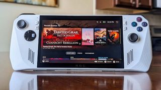 An ROG Ally on a wooden table with SteamOS installed on it.