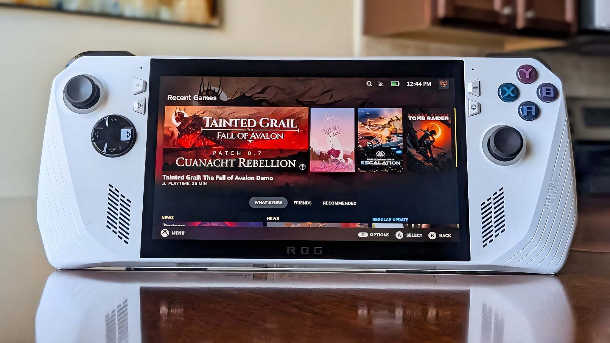 An ROG Ally on a wooden table with SteamOS installed on it. 