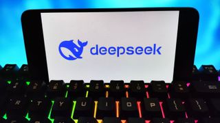 DeepSeek logo on a smartphone mounted on an RGB keyboard.