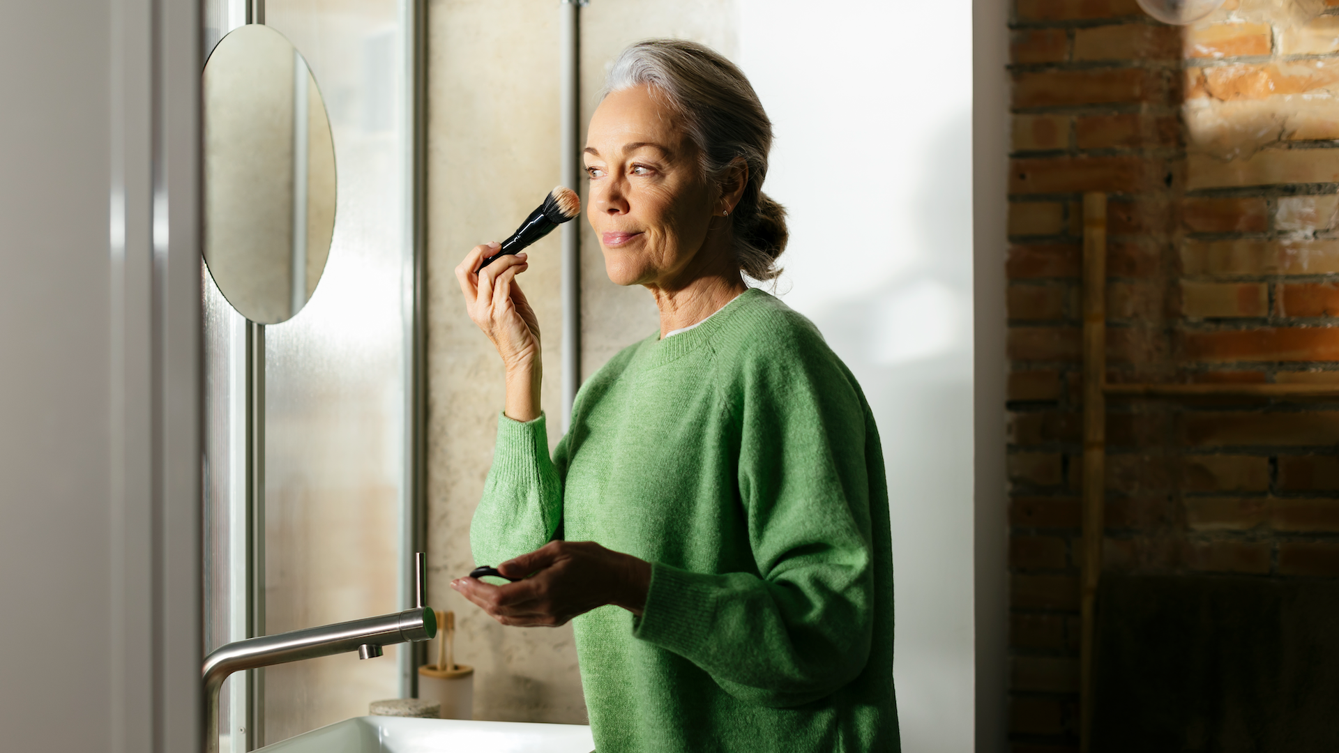 Woman applying make-up