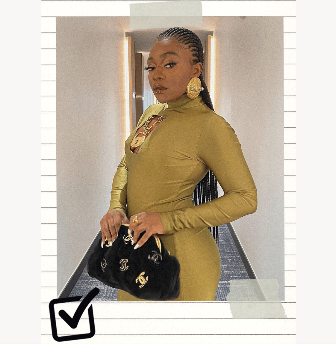 A woman wears gold jewelry, a gold dress, and a black chanel bag.