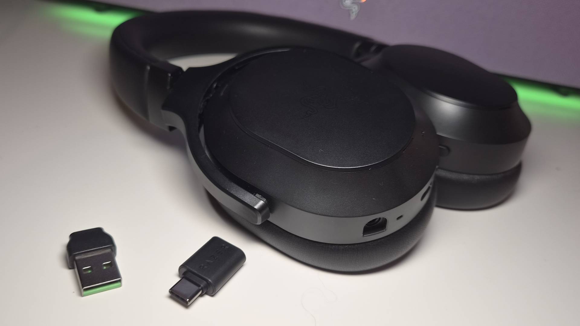 Photo of the Razer Barracuda V2 Pro headset sitting on a white desk.