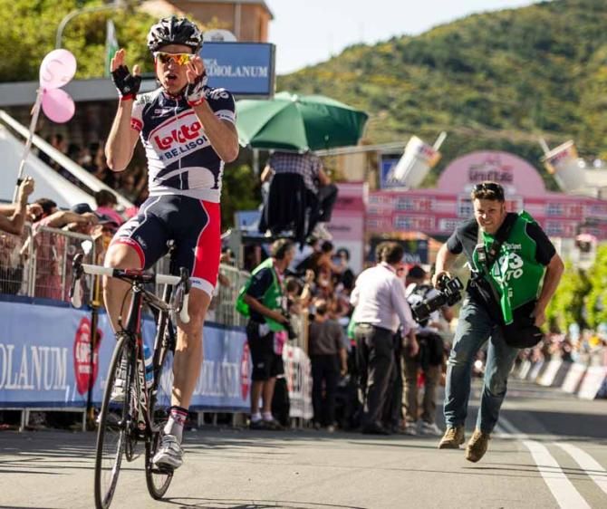 Photographer, Kristof Ramon, chases Lars Bak after the Lotto-Belisol rider triumphed in Sestri Levante