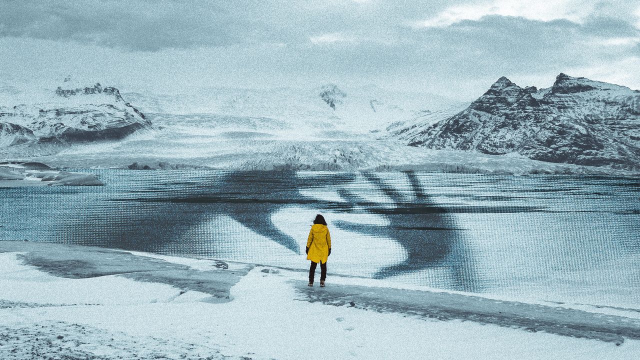 Photo collage of a lone woman facing a polar landscape. There is a frozen lake in front of her, with an overlaid large-scale photo of a woman&#039;s hands pressed against a pane of glass, as if trapped under the ice in distress. The woman&#039;s small silhouette is framed between the large hands