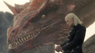 Matt Smith as Daemon Targaryen stands by his dragon Caraxes in House of the Dragon