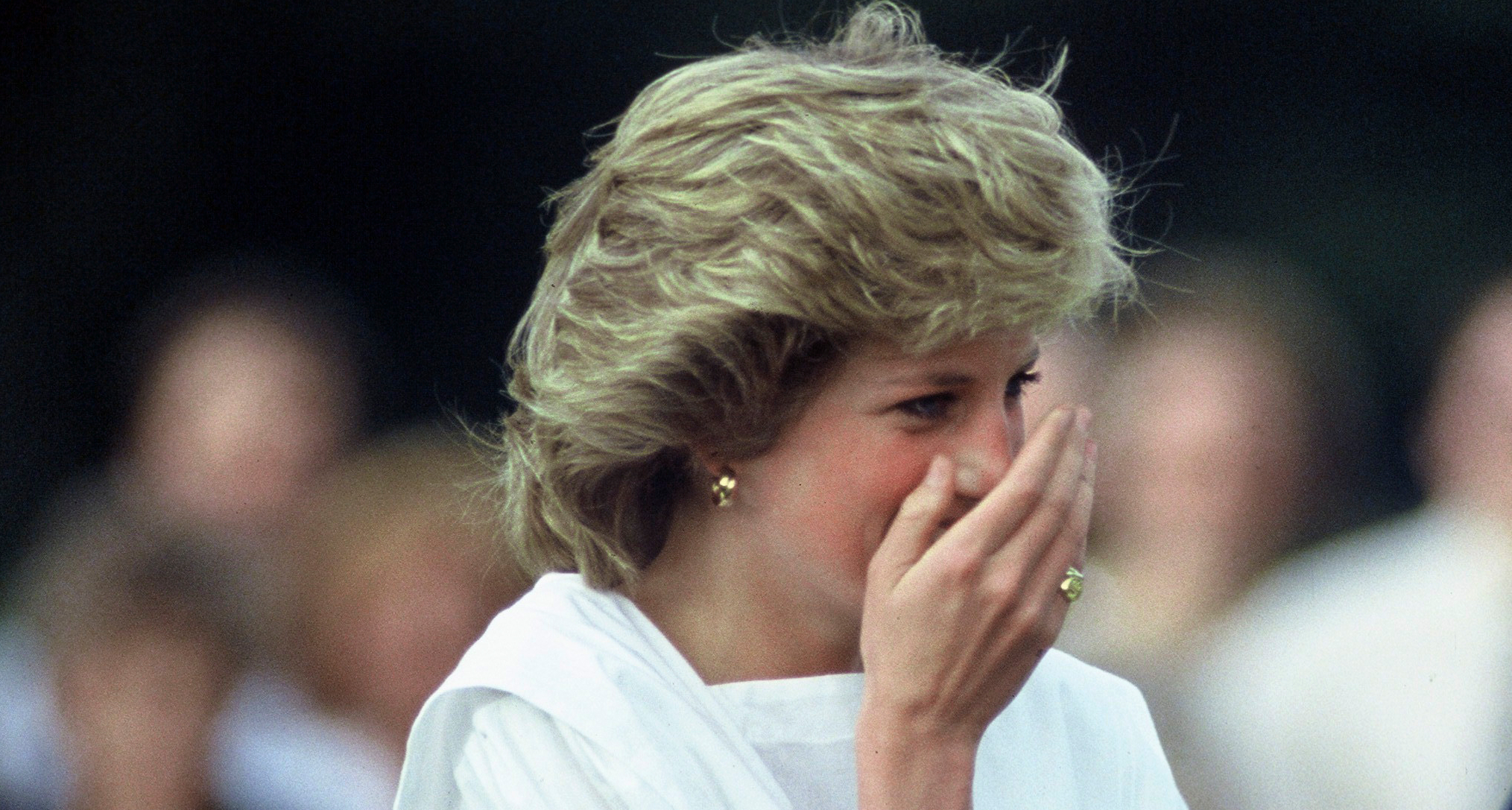 Princess Diana laughing and covering her mouth