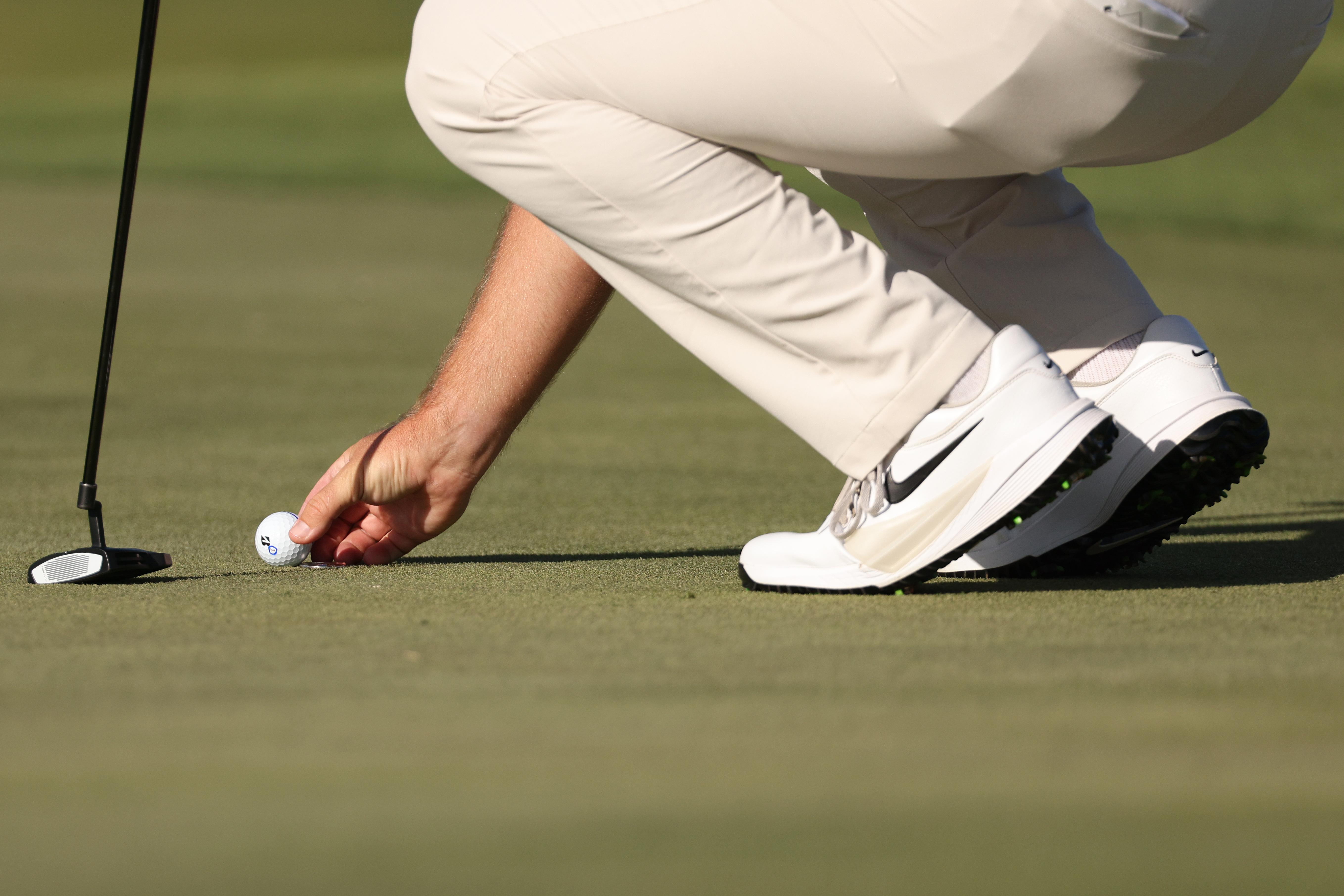 Chris Gotterup lines up a putt