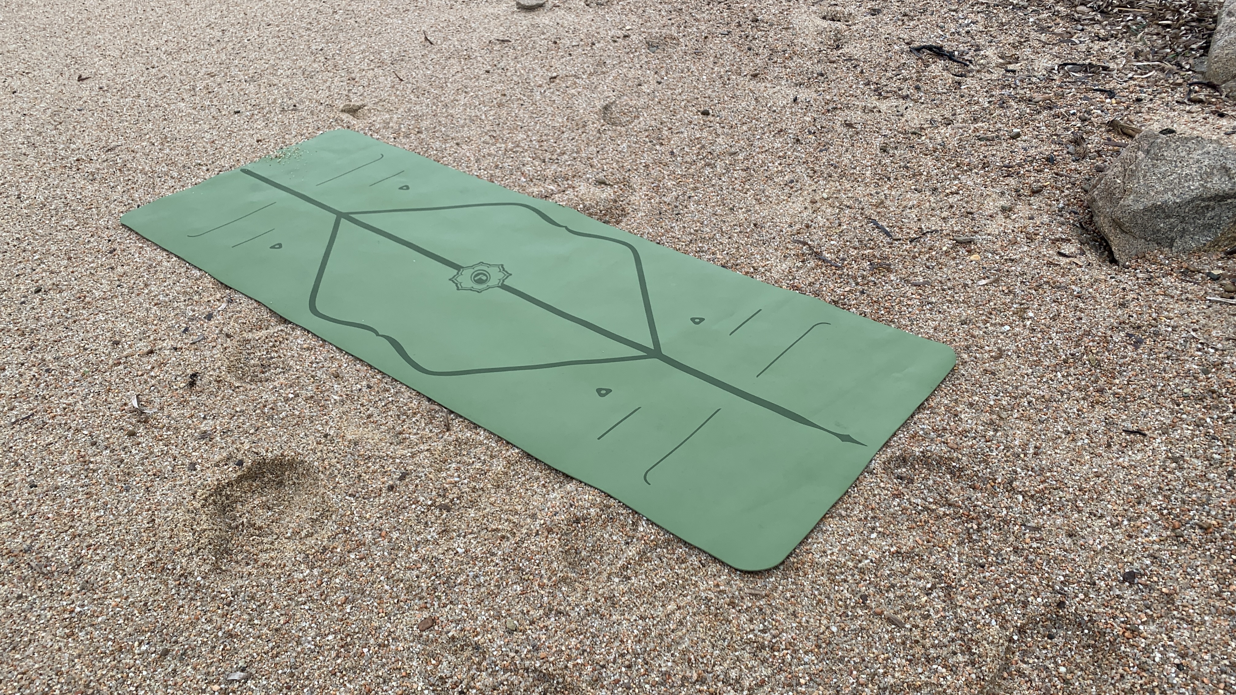 Yoga mat on the beach