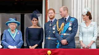 Queen Elizabeth II, Meghan, Duchess of Sussex, Prince Harry, Duke of Sussex, Prince William, Duke of Cambridge and Catherine, Duchess of Cambridge watch a flypast to mark the centenary of the Royal Air Force from the balcony of Buckingham Palace