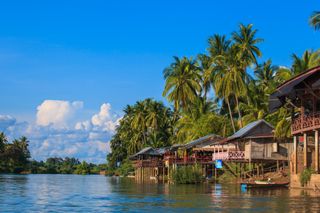 Stilt houses at Mekong river, Laos and Thailand Boarder