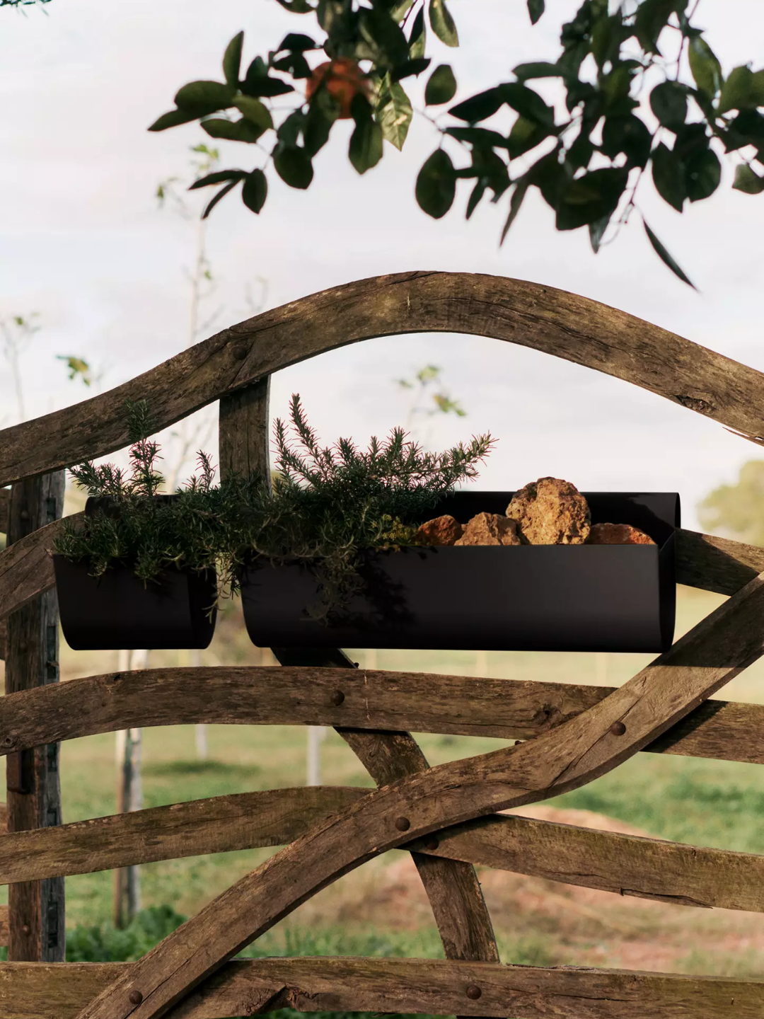 A set of black balcony planters from Ferm Living