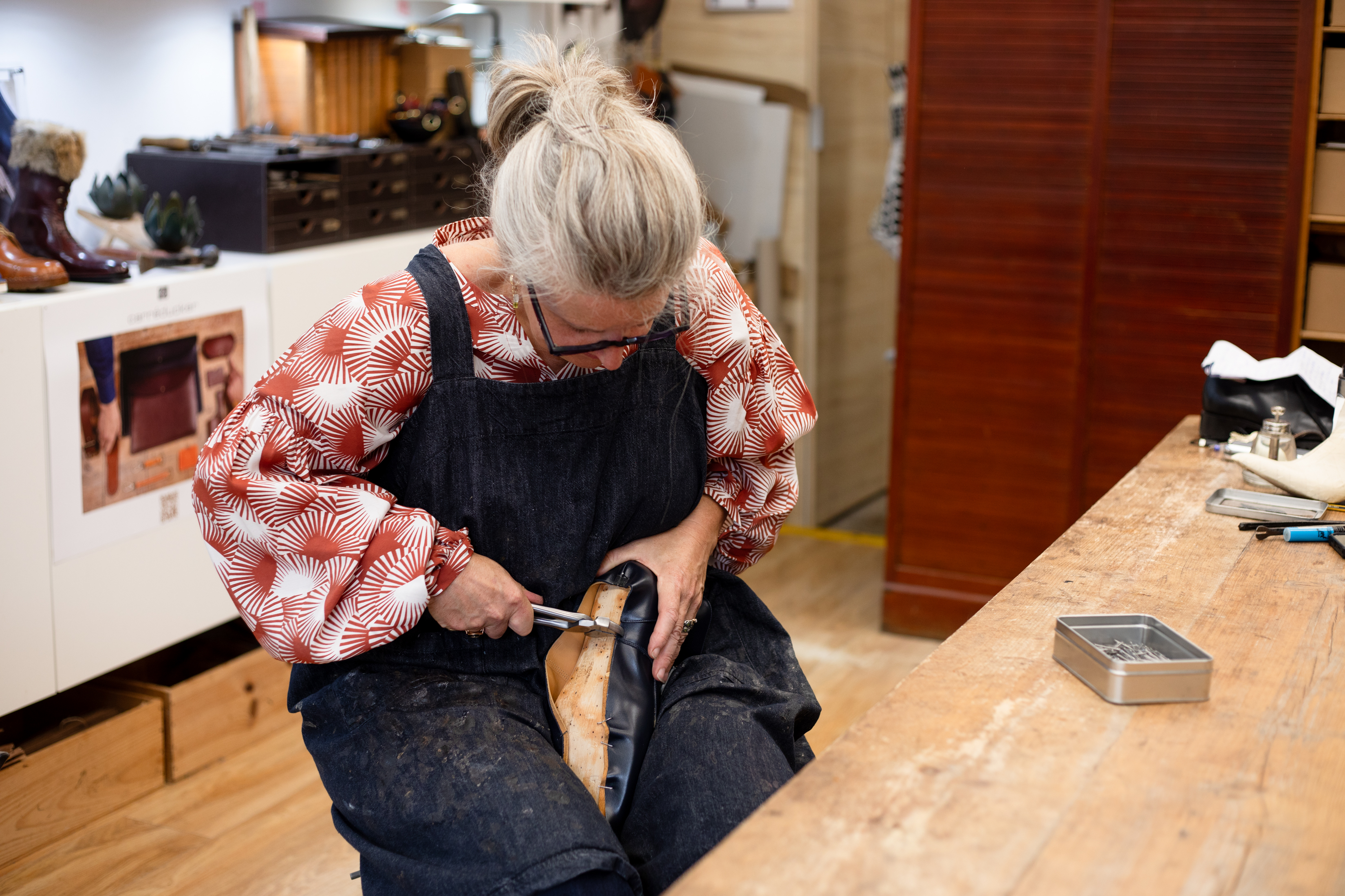 Woman making a shoe by hand