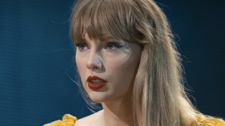 Taylor Swift closeup during "Tolerate It" song in Eras Tour concert film